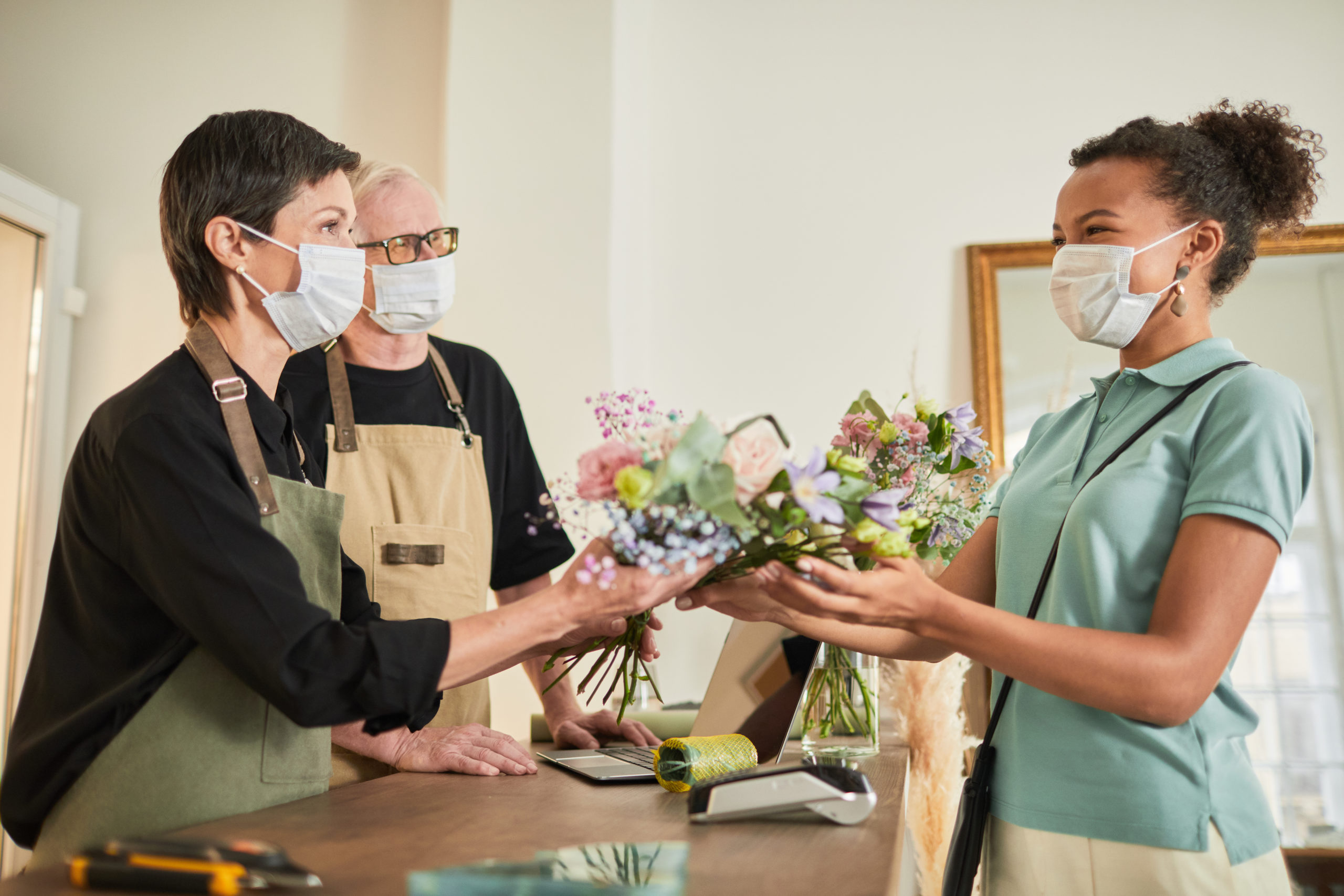 Florists Serving Customer Side View