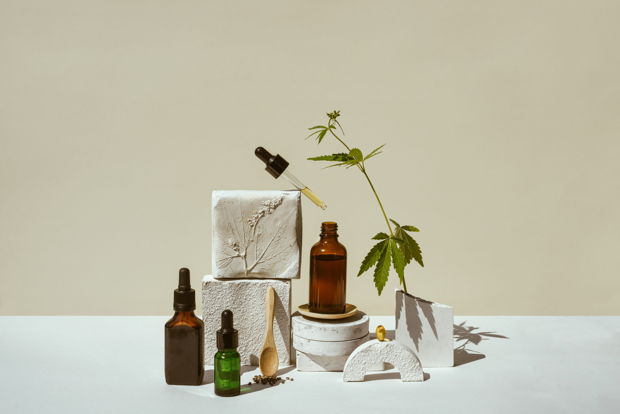 CBD oil, cannabis setting in different bottles, marijuana leaf, cannabis