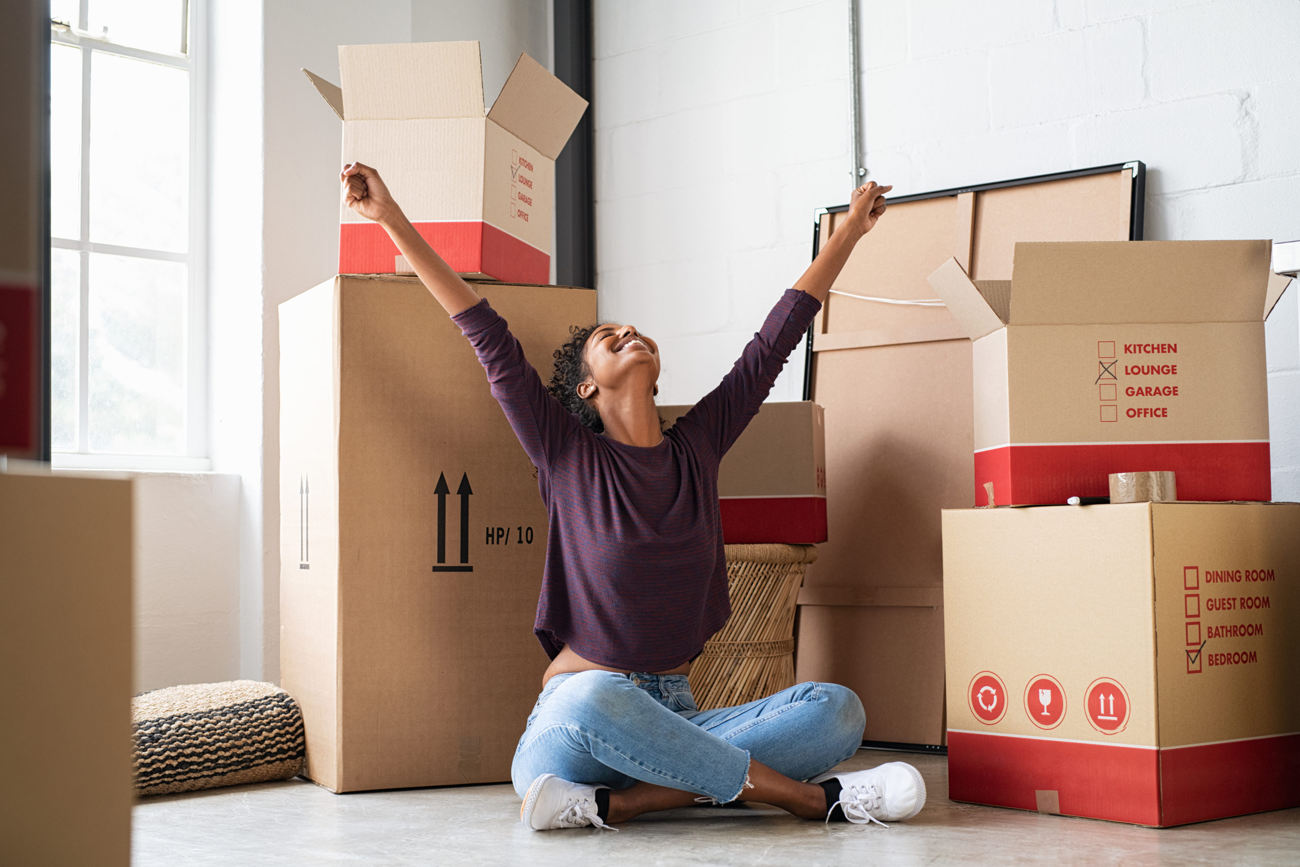 Excited young woman in new house Excited young woman in new house