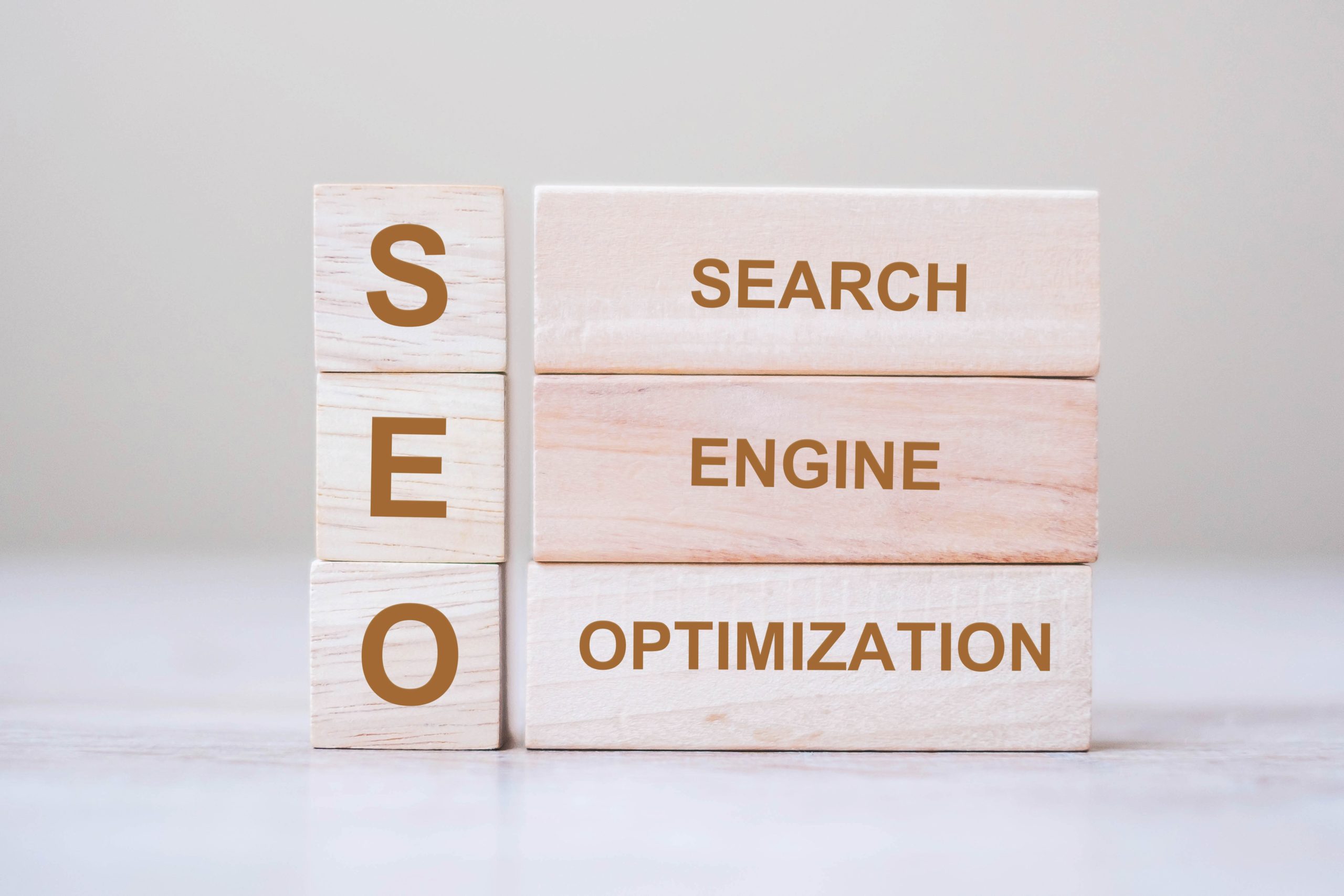 SEO (Search Engine Optimization) text wooden cube blocks on tabl